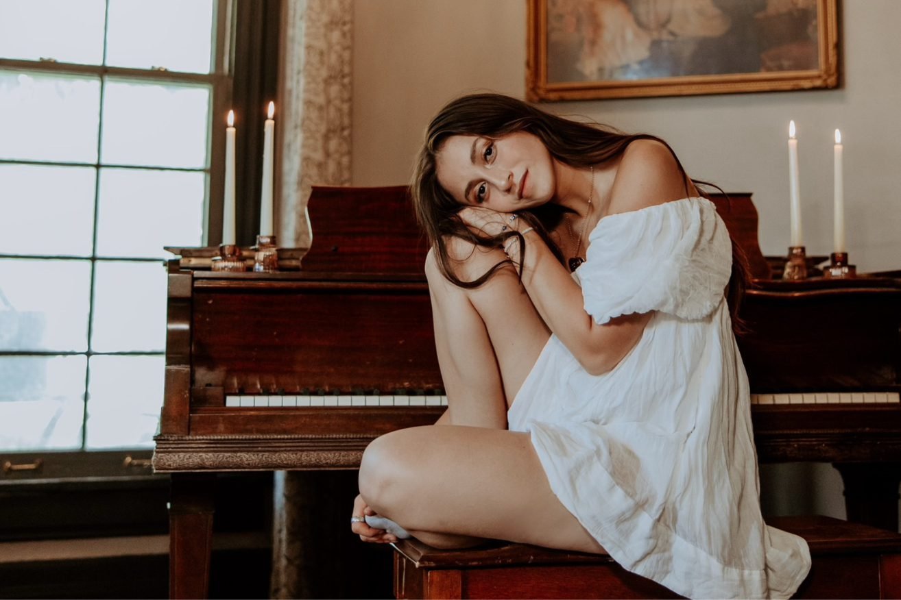While her songs contain whispers of influence from greats like Queen, Stevie Nicks, David Bowie, Elton John, Lana Del Ray, and Taylor Swift, Sophie Louise is an American songwriter with a heart, sound, and message all her own